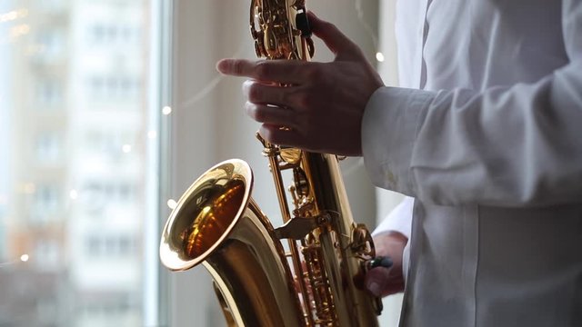 A close-up of a saxophone musician.