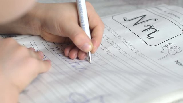child writes prescriptions with his left hand. Lefty learns to write