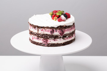 close up of conceptual fruit cake on gray background