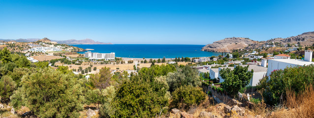 Panoramic view of Vlycha bay (beach) with hotels near Lindos village (Rhodes, Greece)