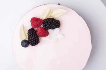 close up of conceptual fruit cake on gray background