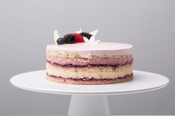close up of conceptual fruit cake on gray background
