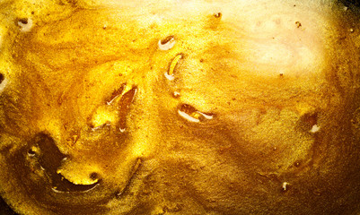 Beautiful abstract golden liquid background, beauty gold backdrop texture. Metallic gold paint, art...