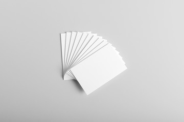 Real photo stack of business cards mockup template, isolated on light grey background to place your design. 