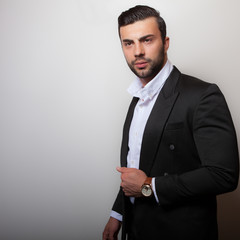 Handsome young elegant man studio portrait.