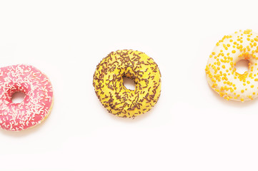 Delicious donuts on light background.