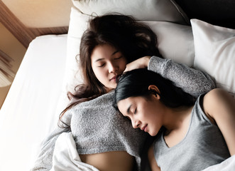 The beautiful women sleeping on bed together,love couple,romantic feeling
