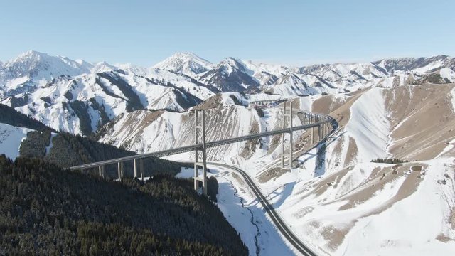 Aerial view of Chine Xinjiang Guozigou bridge (Talki Bridge) in winter season. Drone Shot Footage 4K (UHD).
