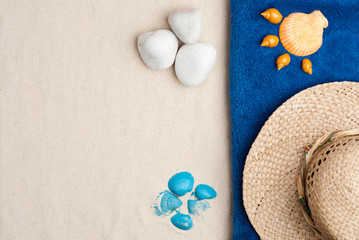 Fototapeta na wymiar Summer time concept with seashells, blue and orange shells, pebbles, straw hat, on white sand background