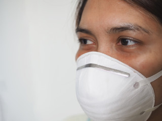 close up of people use dust Masks with white wall background