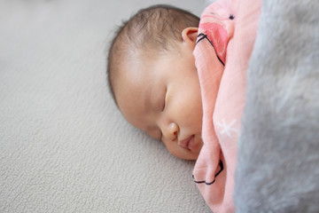 Sleeping newborn baby on a Blanket