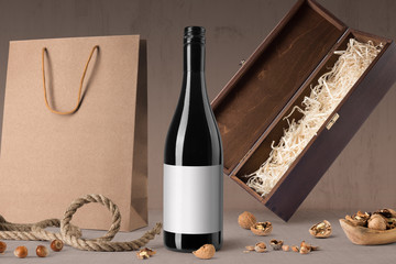Red wine bottle mockup on wooden background, with blank label to place your design