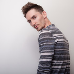 Handsome young elegant man studio portrait.