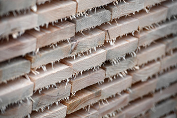 Unpolished, stacked wooden boards on a construction site in Berlin-Germany.
