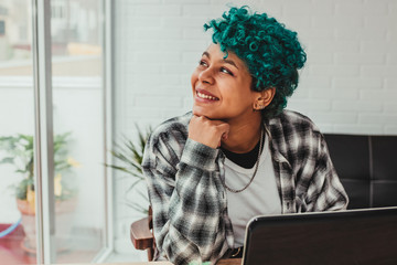 young girl with laptop at home or in the office