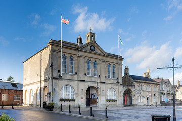 Melksham Town Hall against a blue winter sky with flags flying on a sunny winter late afternoon