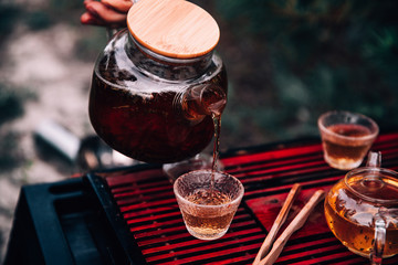Process brewing Tea. Chinese ceremony. Shen Puer. Man hand