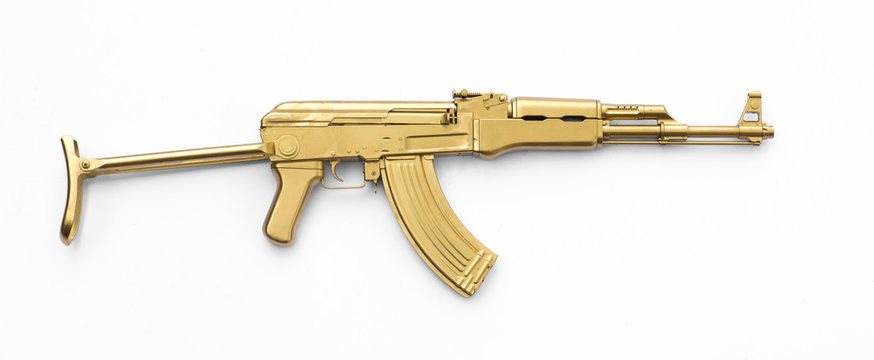 golden AK-47 assault rifle isolated on white background
