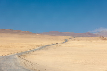 Fototapeta na wymiar Paracas National Reserve, desert in the road.