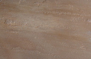Textur eines braunen Sandsteins mit glatter Oberfläche 