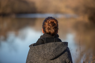 The Glance to the distance, Woman from behind at a river