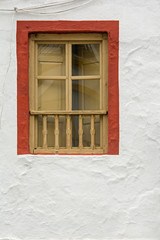 Fototapeta na wymiar Old wooden window of a traditional Spanish house