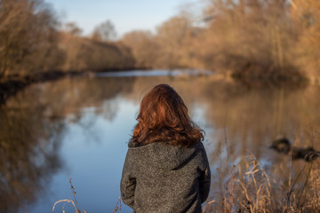 The Glance to the distance, Woman from behind at a river