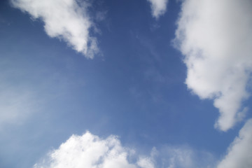 background of white fluffy cumulus clouds