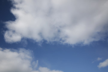 background of white fluffy cumulus clouds