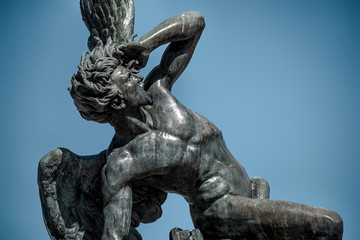 The sculpture of the fallen angel in madrid's retiro park