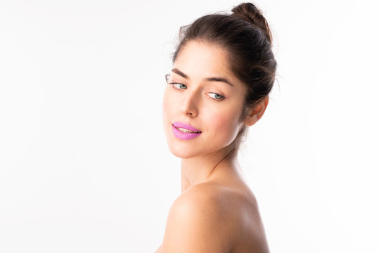 Beauty portrait of young woman with flawless face skin and purple lipstick