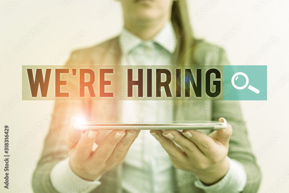 Poster handwriting text we re hiring. conceptual photo process of reviewing applications and finding candid