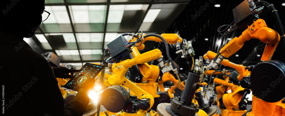 Poster Factory Female Industrial Engineer working with automation robot arms machine in intelligent factory industrial on real time monitoring system software.Digital future manufacture.