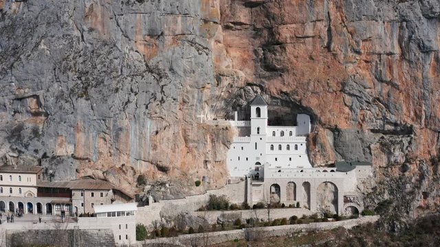 Ostrog Monastery in Montenegro - St. Basil (Sveti Vasilije). This pilgrimage place is managed by Serbian Orthodox Church and is situated high up in a vertical rock. Aerial footage. 