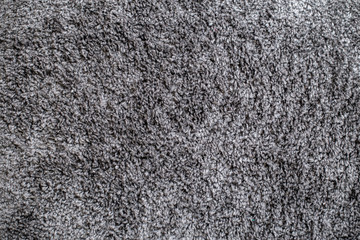 texture of a dark gray soft carpet with a fleecy basis, straight