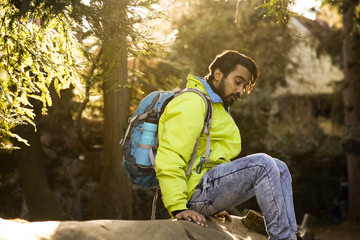 Fototapeta na wymiar young man hiking in a forest