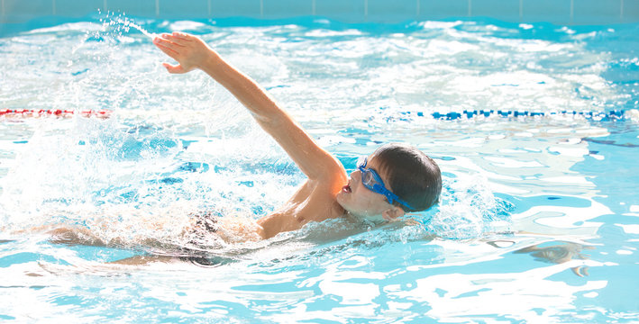 boy swimming  in pool