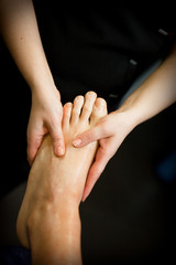Relaxing feet massage in spa