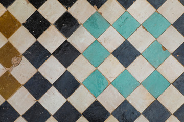 Old square tiles in geometric pattern