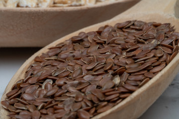 Seeds on a wooden spoon close up
