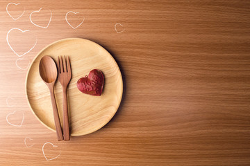dinner with love heart in valentine concept on wood ground