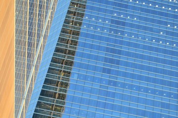 Patterns on the glass facade of a modern building. Architectural background