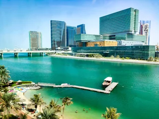 Foto op Canvas Al Maryah Island in Abu Dhabi rising across the seaside © creativefamily
