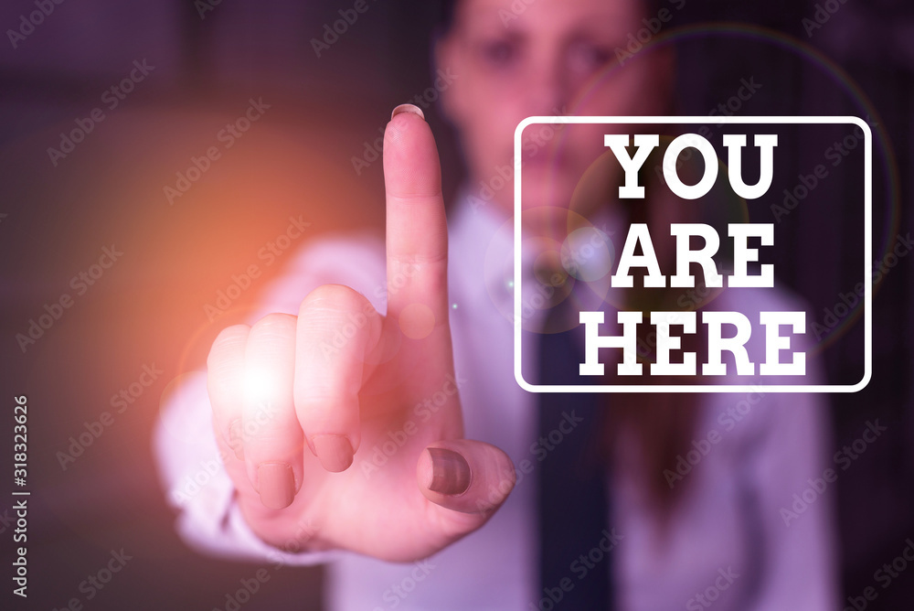 Poster conceptual hand writing showing you are here. concept meaning this is your location reference point 