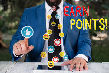 Writing note showing Earn Points. Business concept for collecting scores in order qualify to win...