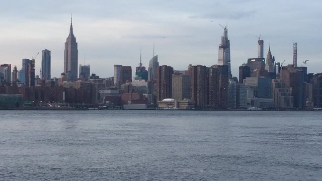 New York midtown Manhattan view across Hudson river showing skyline buildings Empire state building stock footage  