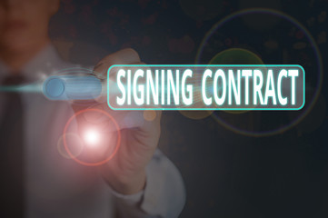 Writing note showing Signing Contract. Business concept for the parties signing the document agree...