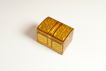 Closed single casket isolated on white with soft shadows, wooden box, wooden chest, treasure chest.