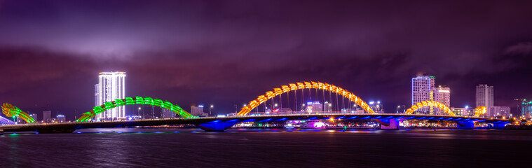 Dragon Bridge (Cau Rong) illuminated at night, Da Nang Vietnam Panorama
