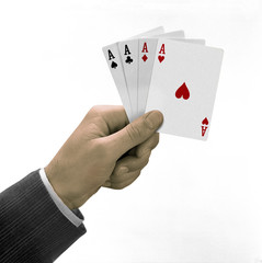 hand holding four aces playing cards